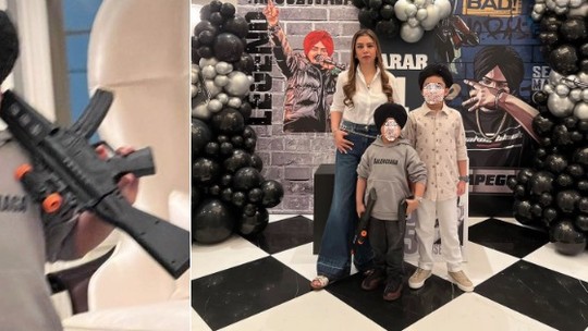 Festa infantil com tema bélico causa polêmica: menino de 4 anos posa com réplicas de fuzis, metralhadora e pistolas